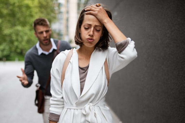 5 Things People Get Wrong About Having an Avoidant Attachment Style - Breakup of couple with man and sad girlfriend outdoor. Divorce, couple, love, pain concept
