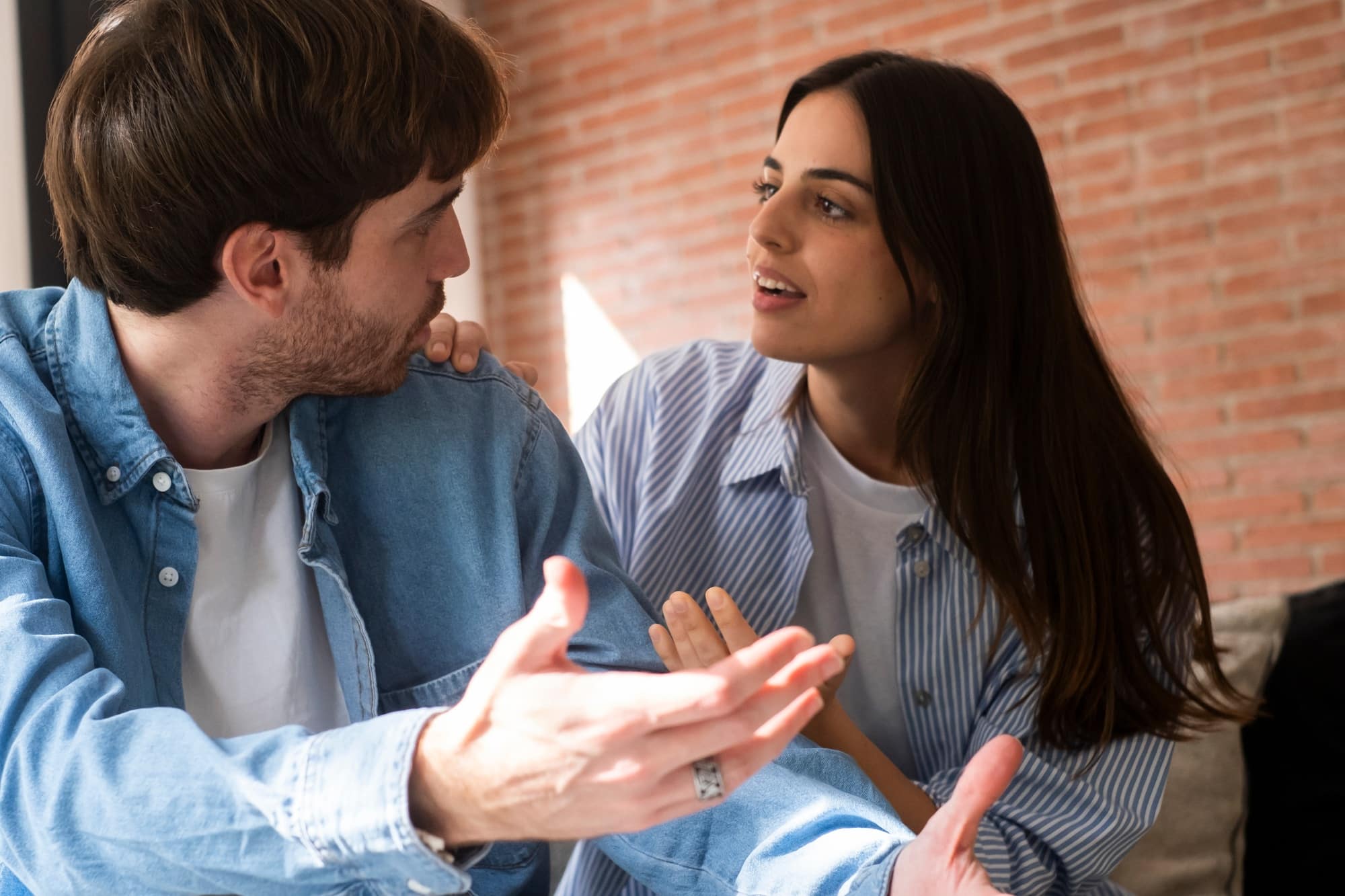 Break up with a dismissive avoidant - close-up of unhappy young couple sitting apart have relationship problems, think about breakup
