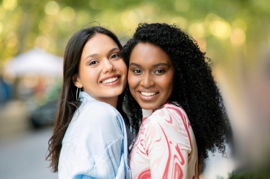 Falling in Love With Your Best Friend: 6 Steps on How to Survive It Without Ruining Everything - Friendship Concept. Portrait Of Two Happy Female Friends Posing Outdoors
