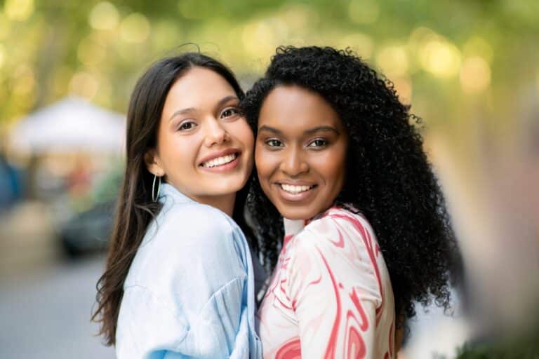 Falling in Love With Your Best Friend: 6 Steps on How to Survive It Without Ruining Everything - Friendship Concept. Portrait Of Two Happy Female Friends Posing Outdoors