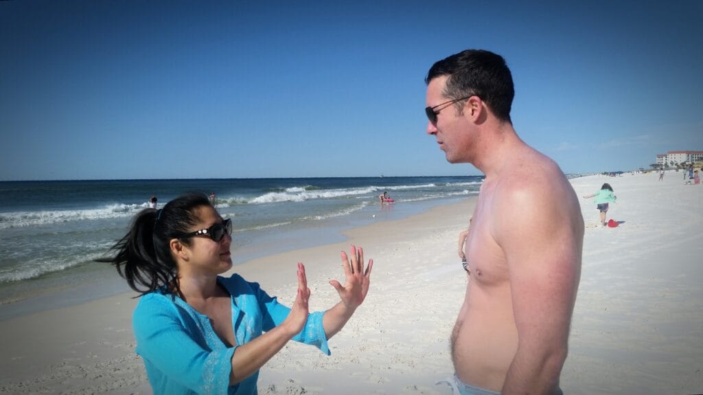 someone you still love - Generation x couple having argument in candids in public places at the beach and he confused.