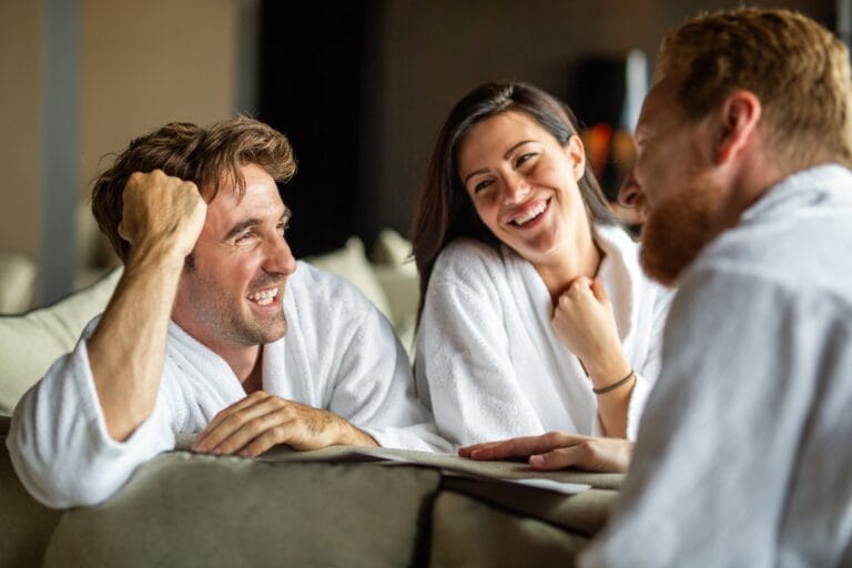 Free relationship concept, swinger clubs. Happy people enjoying relax weekend together in spa hotel