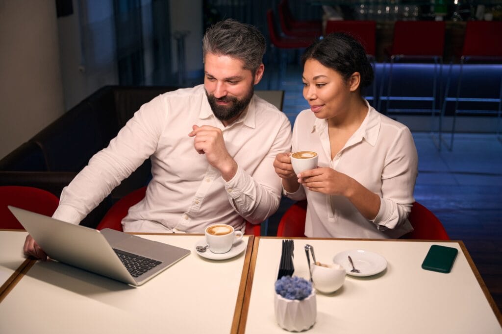 Interracial couple spending time in coffee shop