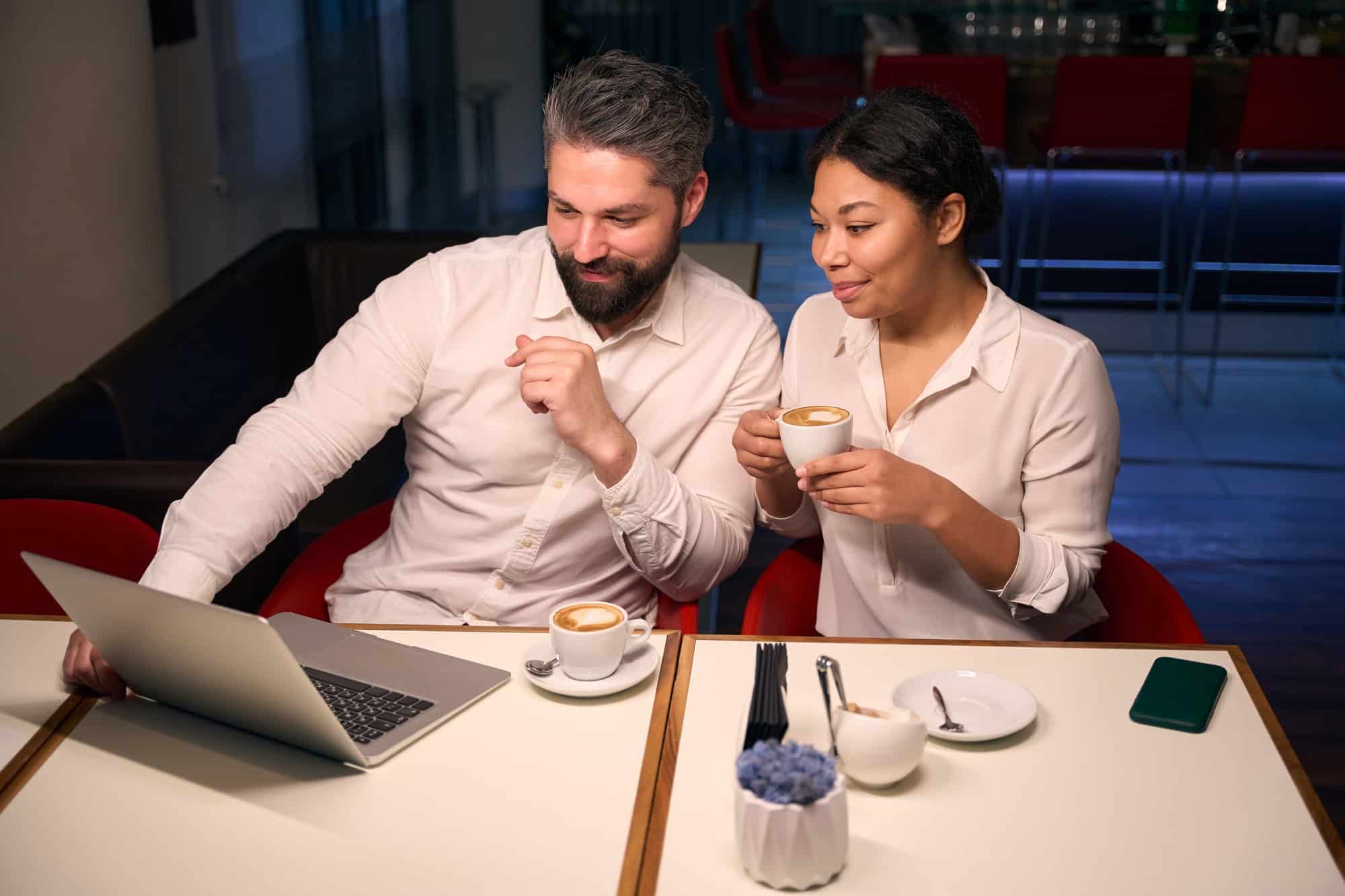 Interracial couple spending time in coffee shop