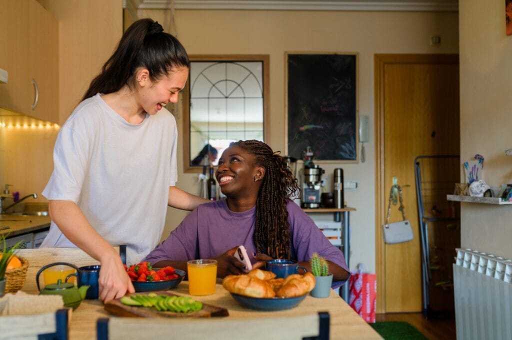 Interracial lesbian couple enjoying breakfast together