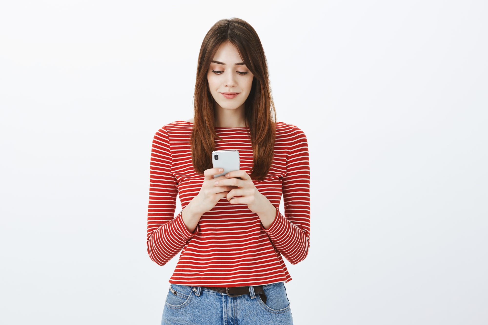 Girl seeking soulmate in date app. Portrait of charming focused female office worker, typing message